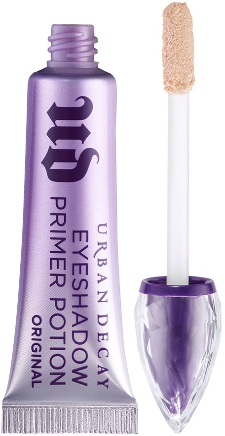 Lila tub med Urban Decay ögonskuggspreparat och applikator.