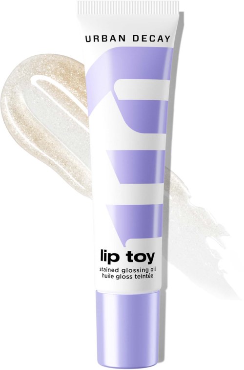 Urban Decay lip toy stained glossing oil i lila och vit tub med prov på glans bakom.
