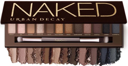Oogschaduwpalet met verschillende tinten en een dubbele kwast in een bruin doosje met 'Naked Urban Decay' op de bovenkant.
