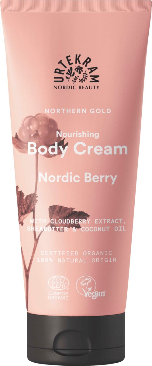 Pink body cream tube with a black cap, labeled 'Northern Gold Nourishing Body Cream' with Nordic berry, cloudberry, and coconut symbols.
