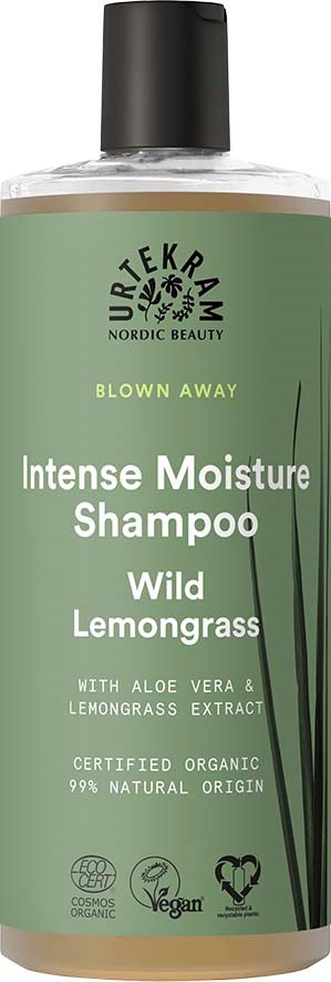 Een fles shampoo met een groene label, zwarte dop en tekst over biologische ingrediënten en vegan certificering.