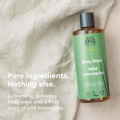 A body wash bottle with green label, mentions pure ingredients and wild lemongrass scent, with text about cleansing and softness.