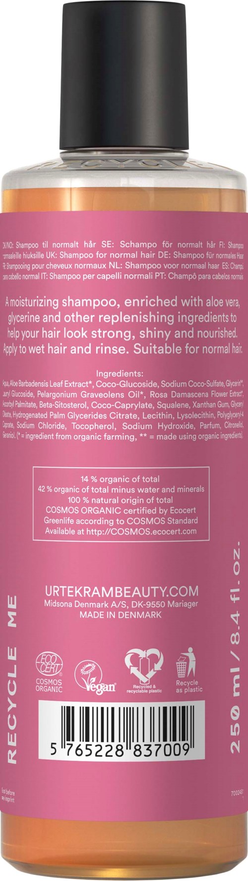 Pink bottle of moisturizing shampoo with black cap, contains aloe and other ingredients for shiny hair.