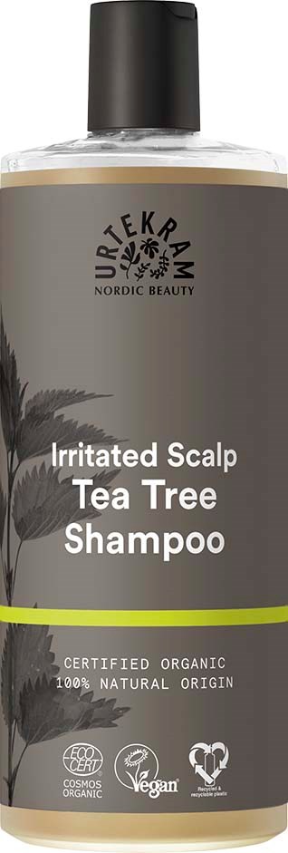 Een grijze fles met zwarte dop, gelabeld 'Urtekram Nordic Beauty' met details over tea tree shampoo.