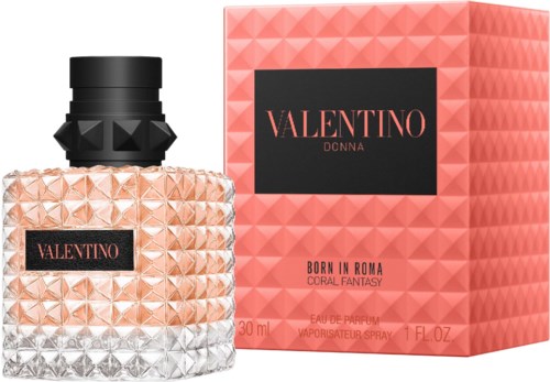 Ein Parfümflasche und eine Schachtel mit rosa geometrischen Mustern, Valentino Donna Coral Fantasy-Etikett und schwarzem Deckel.