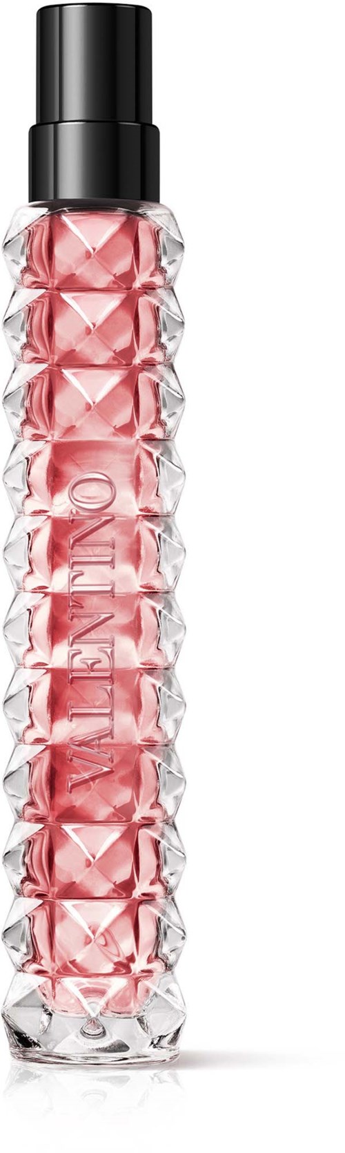 Eine lange, klare Flasche mit schwarzem Deckel, gefüllt mit rosa Flüssigkeit und strukturierter Oberfläche. Das Wort 'ALIEN' ist an der Seite.