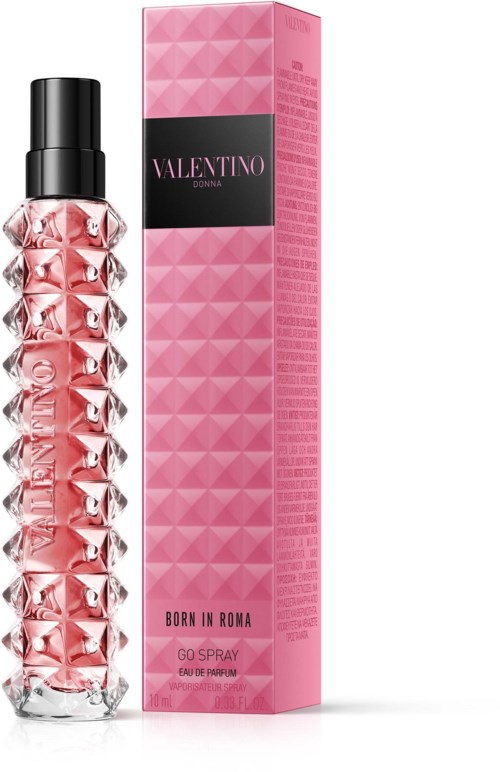 Eine rosa Parfühflasche mit Diamantmuster neben einer passenden rosa Verpackung mit dem Markennamen Valentino.
