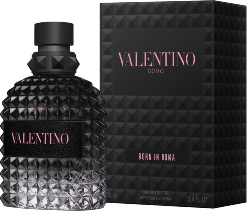 A black perfume bottle with a textured, studded surface and a matching box, both with pink Valentino labels.