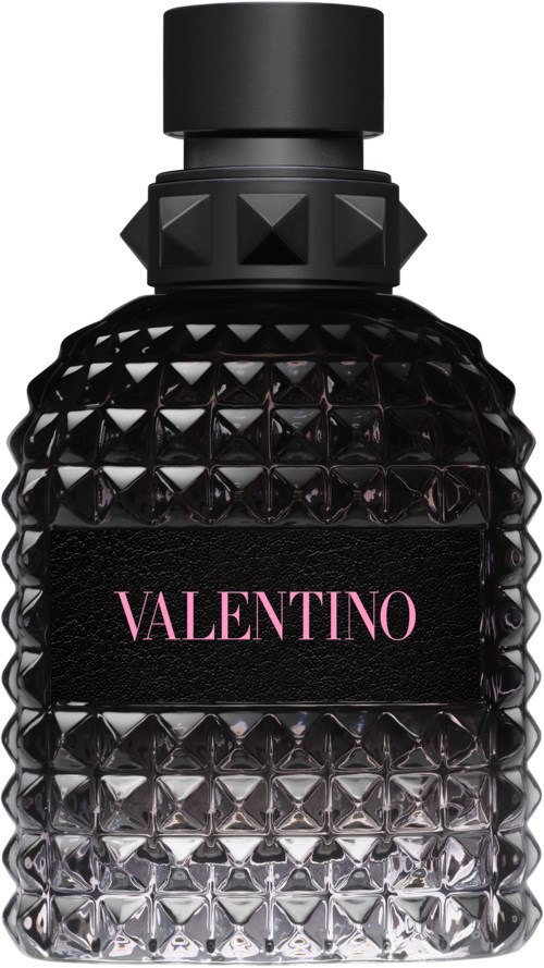 Een zwart parfumflesje met een getextureerd, diamantachtig patroon en een roze Valentino-etiket.