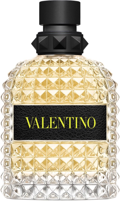Ein Parfümflasche mit schwarzem Deckel, einer strukturierte goldenen und klaren Glasflasche, und einem schwarzen Etikett mit gelbem 'VALENTINO'-Text.