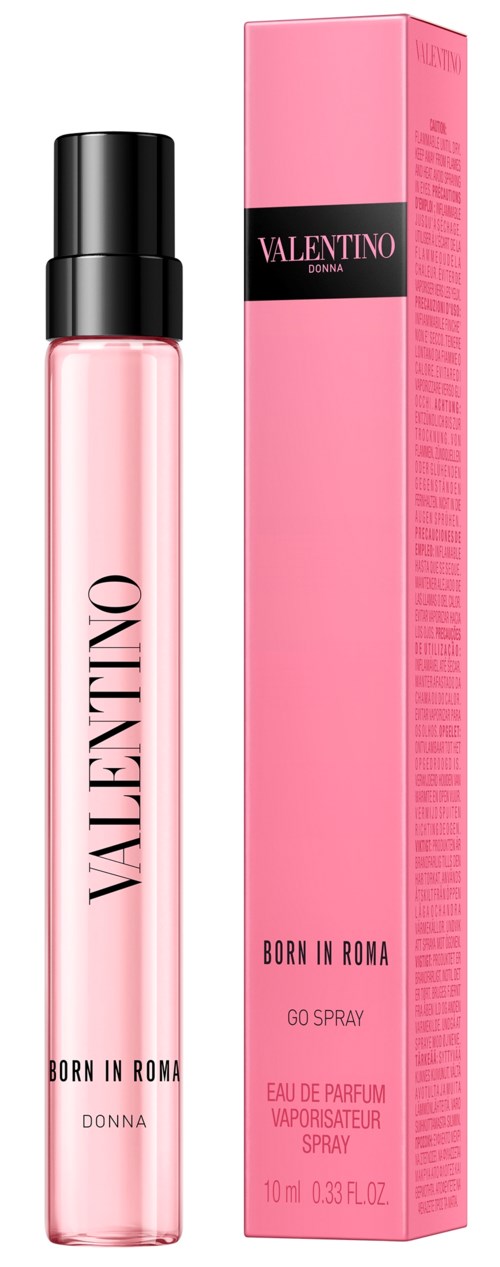 En rosa parfymflaska med svart lock bredvid sin rosa förpackning, märkt Valentino Born in Roma.