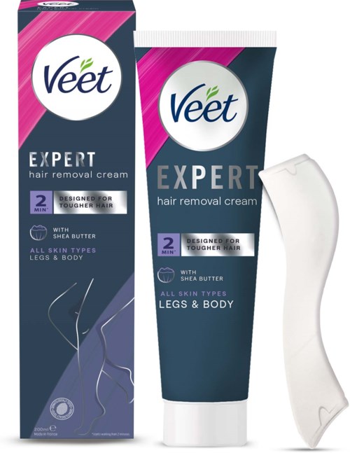 Eine Tube und Schachtel mit Veet Expert Haarentfernungscreme für Beine und Körper, mit einem weißen Spatel.