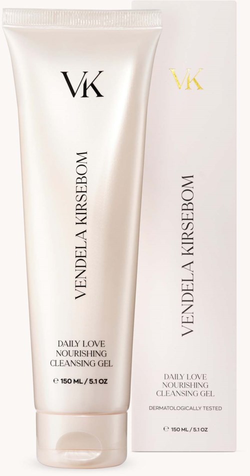 A white tube of Nourishing Cleansing Gel with black and gold lettering, with its box behind it.