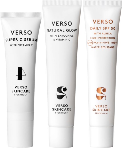 Drie witte tubes huidverzorgingsproducten met zwarte, grijze en oranje tekst en logo's, staand recht.