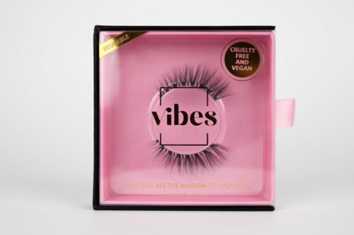 Pink packaging with black lashes, a logo that says "vibes," and a label indicating cruelty-free and vegan.