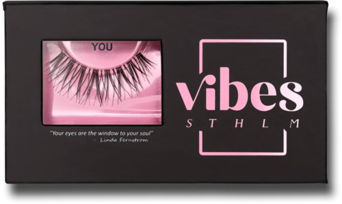False eyelashes in packaging with pink and black design, with the words "vibes" and a quote about eyes.