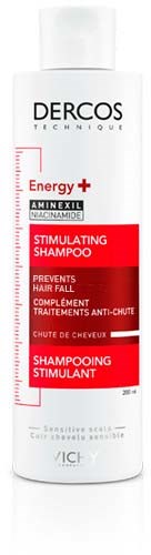 Eine weiße Shampooflasche mit Dercos Technique Energy+ und rot-schwarzen Akzenten, fördert Haarausfallprävention.