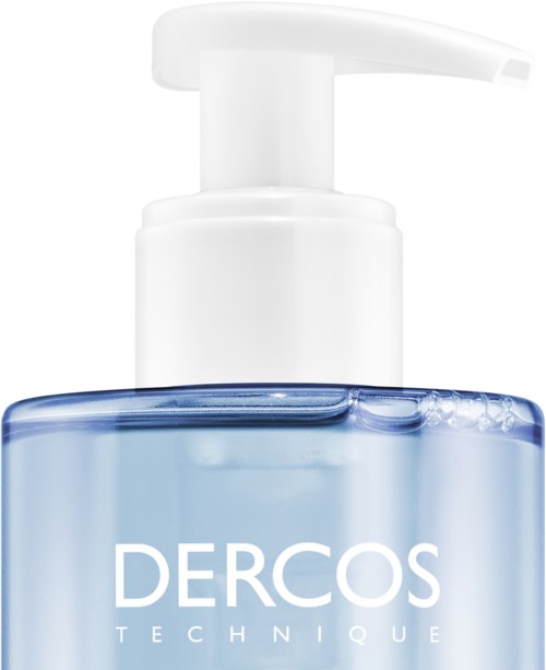 Klarer blauer Flüssigkeit in einer Pumpflasche mit der Aufschrift 'Dercos Technique'.