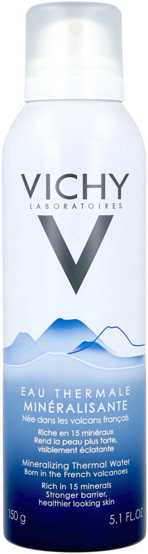 Weiße Sprühflasche mit Vichy-Logo und blauer Berggrafik, fördert mineralhaltiges Thermalwasser aus französischen Vulkanen.