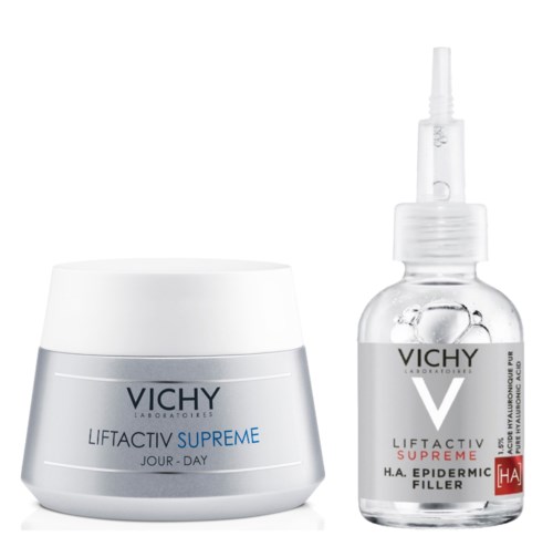 Ein weißer Behälter und eine kleine klare Flasche mit Nadel oben, beide mit Vichy Liftactiv Supreme Hautpflegeprodukten.