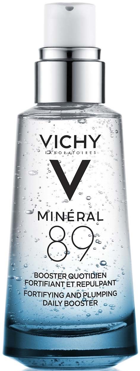 Een doorzichtige fles met witte pomp toont Vichy Mineral 89 dagelijkse booster met waterachtige vloeistof en bellen binnen.