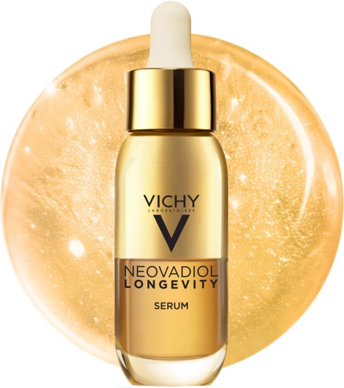 Vichy Neovadiol Longevity serum bottle with gold cap in front of a glowing gold background.
