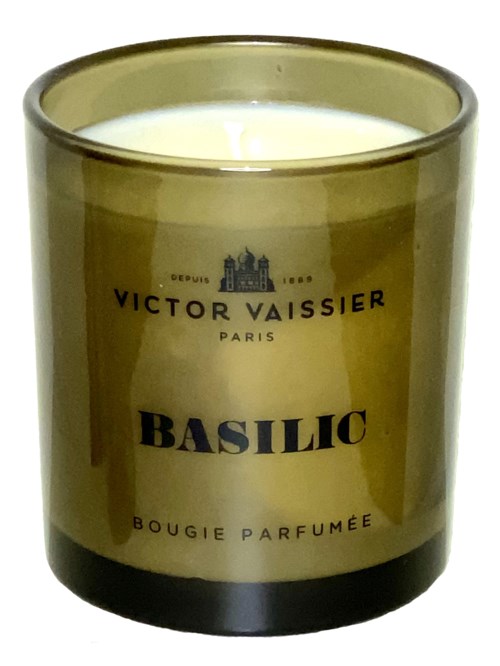 A greenish candle jar labeled 'Basilic' by Victor Vaissier, with white wax inside.