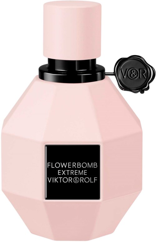 Roze geometrisch parfumflesje met zwart label en ronde dop, verbonden met een zwart zegel met V&R.