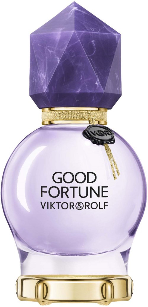 En parfyllflaska med ett lila, facetterat lock och en klar rund kropp, märkt "Good Fortune" av Viktor & Rolf.