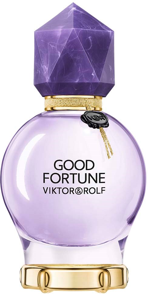 En lila parfymflaska med en stor lila ädelsten på toppen och gyllene detaljer, märkt 'Good Fortune Viktor & Rolf'.