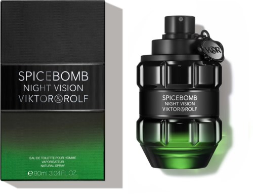 Een zwart parfumflesje in de vorm van een handgranaat naast een groene en zwarte doos.