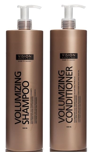 Zwei Flaschen, eine für Shampoo und eine für Conditioner, mit Pumpen und passender beiger Verpackung.