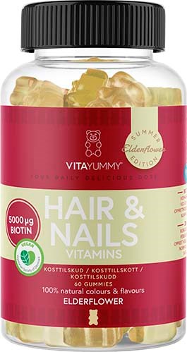 Een fles haar- en nagelvitaminen met elderflower smaak, bevat 5000 microgram biotine en heeft een rood-witte label.