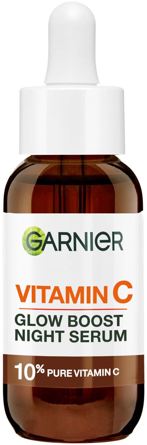 A small brown bottle with a white dropper, labeled Garnier Vitamin C Night Serum with 10% pure Vitamin C.
