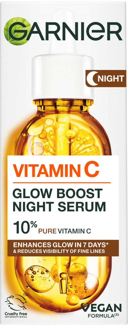 A box of Garnier Vitamin C Glow Boost Night Serum with an orange bottle image, details about the product, cruelty-free and vegan.