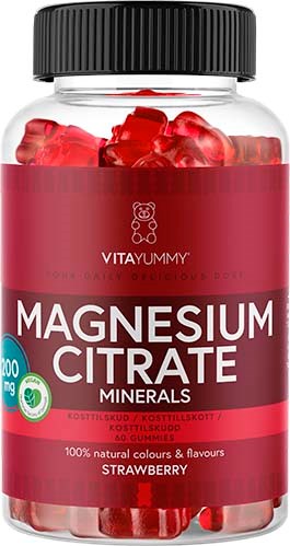 En glasskål fylt med røde jordbærlike magnesium citrate-gummibjørner, merket som kosttilskudd med rød og hvit design.