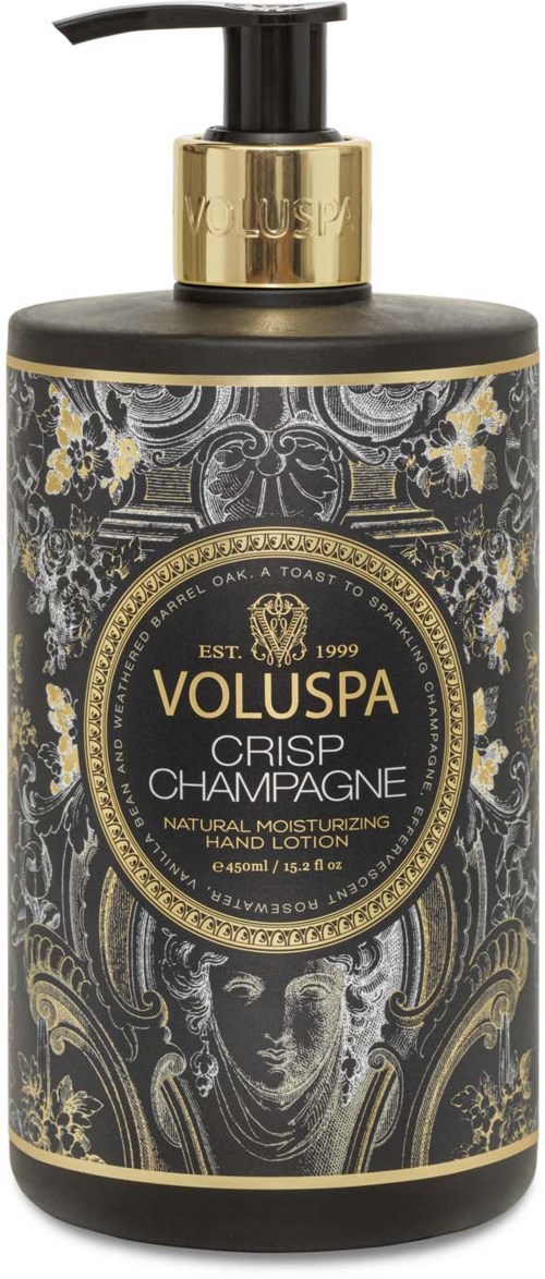 Eine schwarze Flasche mit goldener Pumpe, beschriftet 'Voluspa Crisp Champagne' Handlotion, verziert mit aufwändigen Gold- und Graumustern.