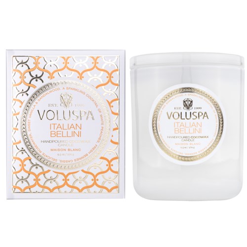 A scented candle with orange and white packaging, labeled 'Voluspa Italian Bellini,' and a white candle inside.