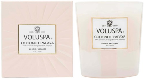 Två vita ljusförpackningar, en med blommönster, båda märkta 'Voluspa Coconut Papaya.'