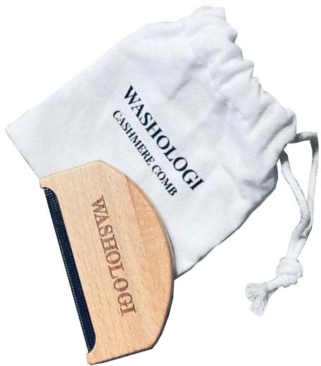A wooden brush and a white cloth bag labeled 'WASHOLOGI' and 'CASHMERE COMB' are shown. There is also a dark strip on the brush.