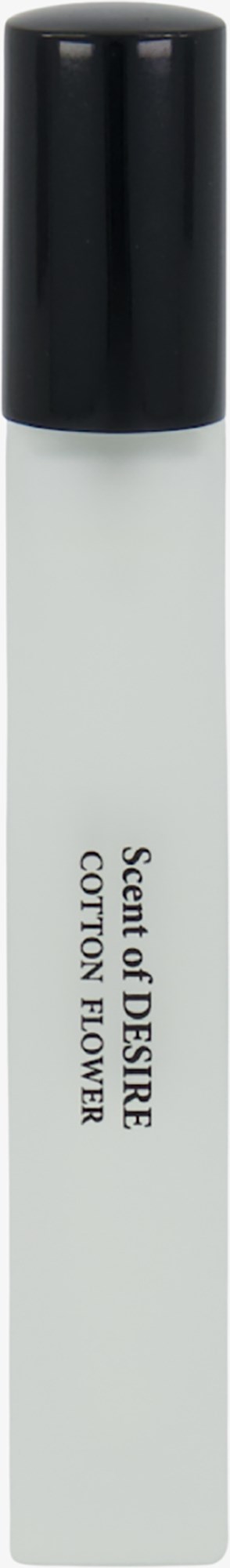 En vit flaska med svart lock märkt "Scent of DESIRE COTTON FLOWER."