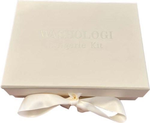 A white box labeled 'WASHOLOGIE Lingerie Kit' with a satin ribbon bow on it.