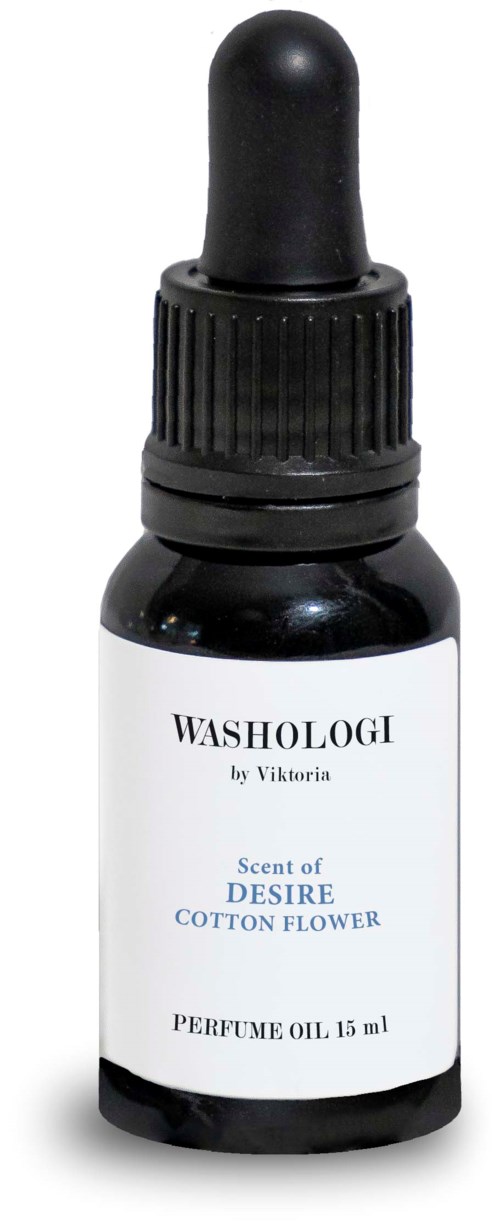 A small black bottle with a dropper cap, labeled as perfume oil with scent of desire cotton flower.
