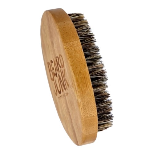 A round brush with a wooden handle and black and white bristles, branded with 'BEARD JUNK' logo.