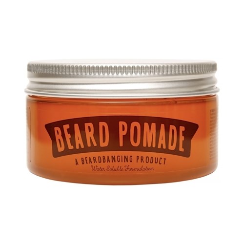 A jar labeled 'Beard Pomade' with a silver lid, orange container, and black text describing the product.