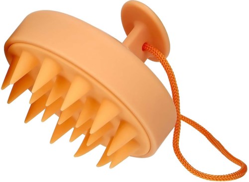 En rund gul massager med många tjocka piggar och en liten orange tråd för att hänga.