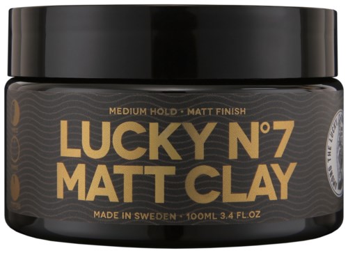 Ein schwarzer Behälter mit Lucky N°7 Matte Clay Haarstylingprodukt aus Schweden. Für mittleren Halt und matten Look.