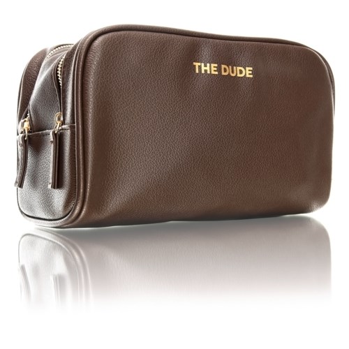 A brown leather bag with gold text 'THE DUDE' on front and zippers on sides.