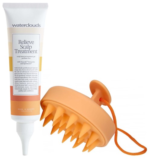 Een tube haarruw en een massageborstel met zachte punten en oranje koord.