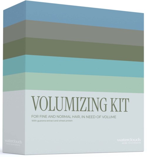 A box labeled Volumizing Kit for hair, with green and blue horizontal stripes on a light background.